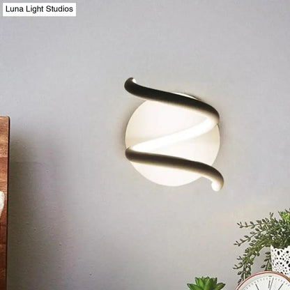Modern black acrylic spiral sconce with a sleek curved metallic frame and frosted glass diffuser light fixture