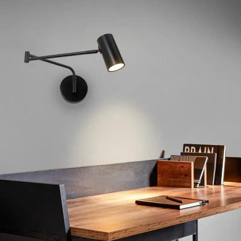 Black matte wall lamp with articulated arm and cylindrical head made of decorbites acrylic iron led for bedroom reading light