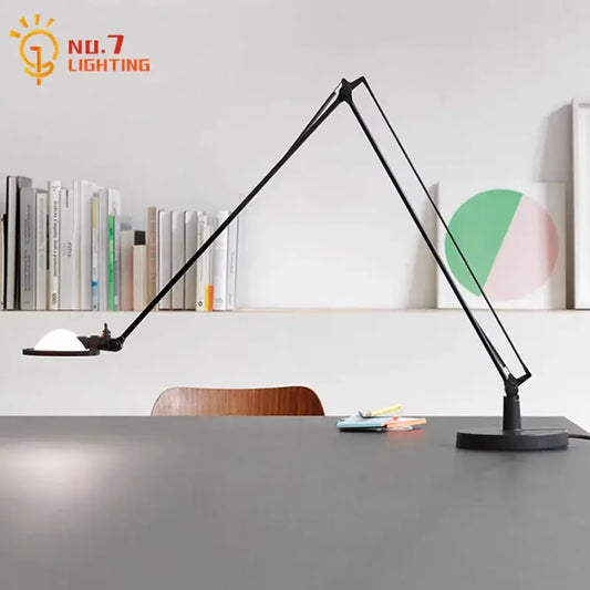 Modern black adjustable led desk lamp with sleek articulated design and circular white light diffuser for study or bedroom decorbites