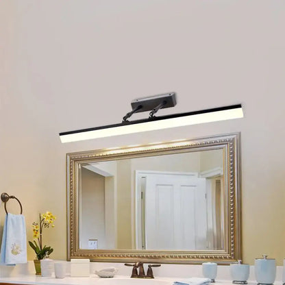 Modern black adjustable led wall light with maximum bulb wattage mounted above a framed mirror for bathroom vanity