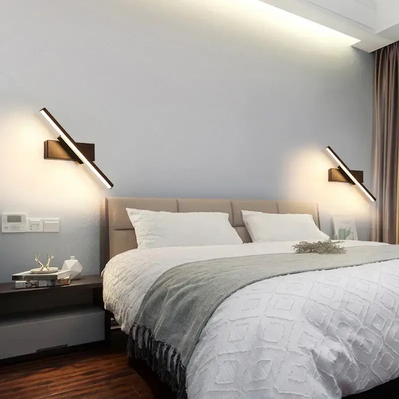 Modern black adjustable led wall sconce with sleek dark bronze finish and integrated led lighting for bedroom use