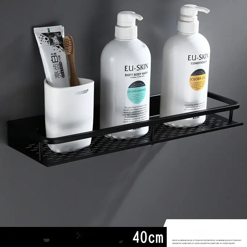 Modern black aluminum bathroom shelf with towel bar featuring a textured grid surface and three compartments for toiletries by decorbites
