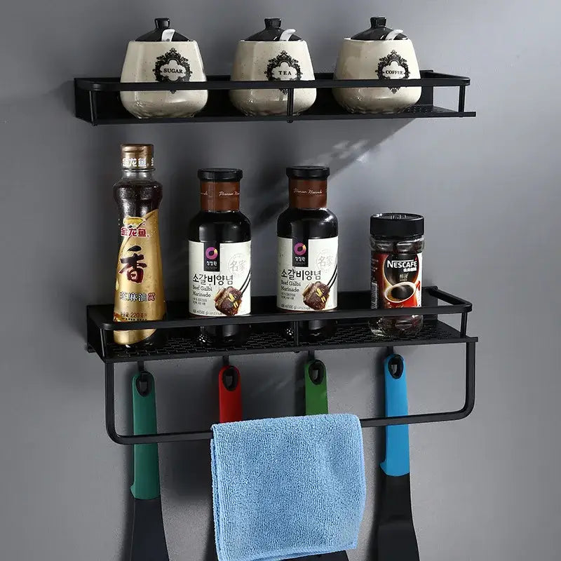 Modern black aluminum bathroom shelf with towel bar holding ceramic canisters bottles and hanging utensils by decorbites black aluminum