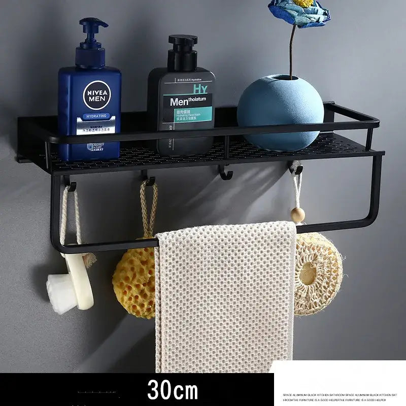 Modern black aluminum bathroom shelf with towel bar featuring a mesh surface holding toiletries and towels decorbites black aluminum