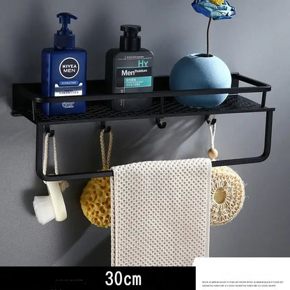Modern black aluminum bathroom shelf with towel bar featuring a mesh surface holding toiletries and towels decorbites black aluminum