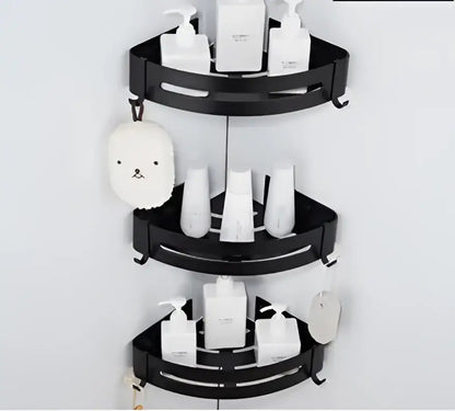 Black three-tiered corner shelf with sleek curved shelves and hooks made of decorbites black aluminum wall mount