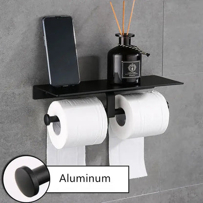 Modern black aluminum double toilet paper holder with dual rolls and a shelf for bathroom accessories