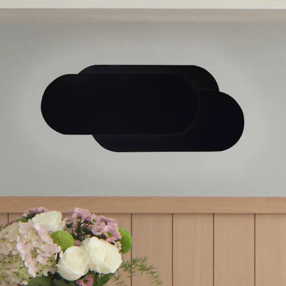 Modern black aluminum oval wall washer lamp with black cloud-shaped wall decal for bedroom light decor