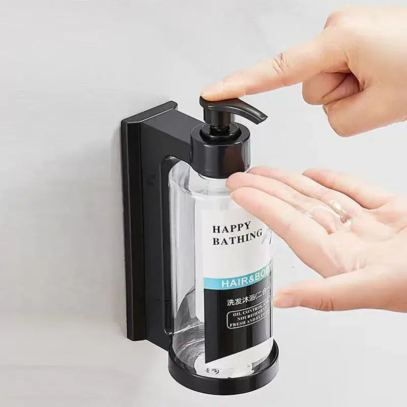 Black wall-mounted amber soap dispenser with clear glass bottle and black pump for hair and body by decorbites amber soap