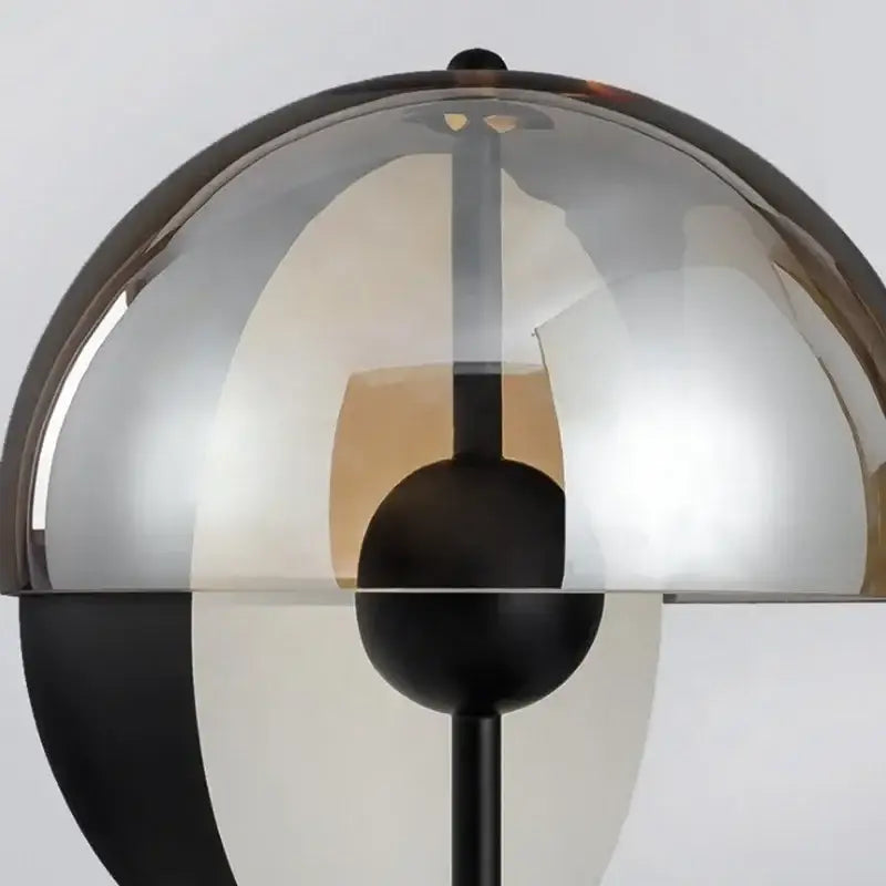 Modern black and amber decorbites glass table lamp with transparent dome shade and metal base for bedroom decor