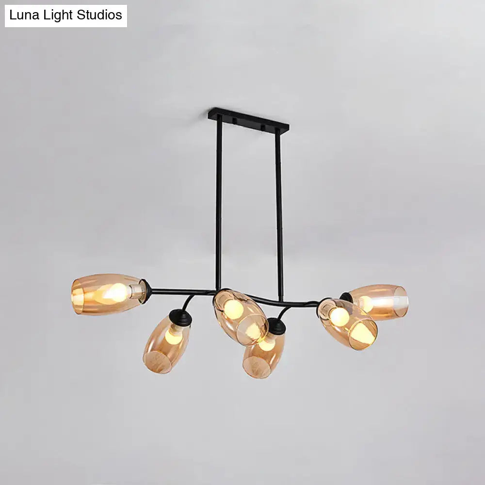 Modern black metal island pendant light with six amber-tinted glass shades and branch design for ceiling mounting