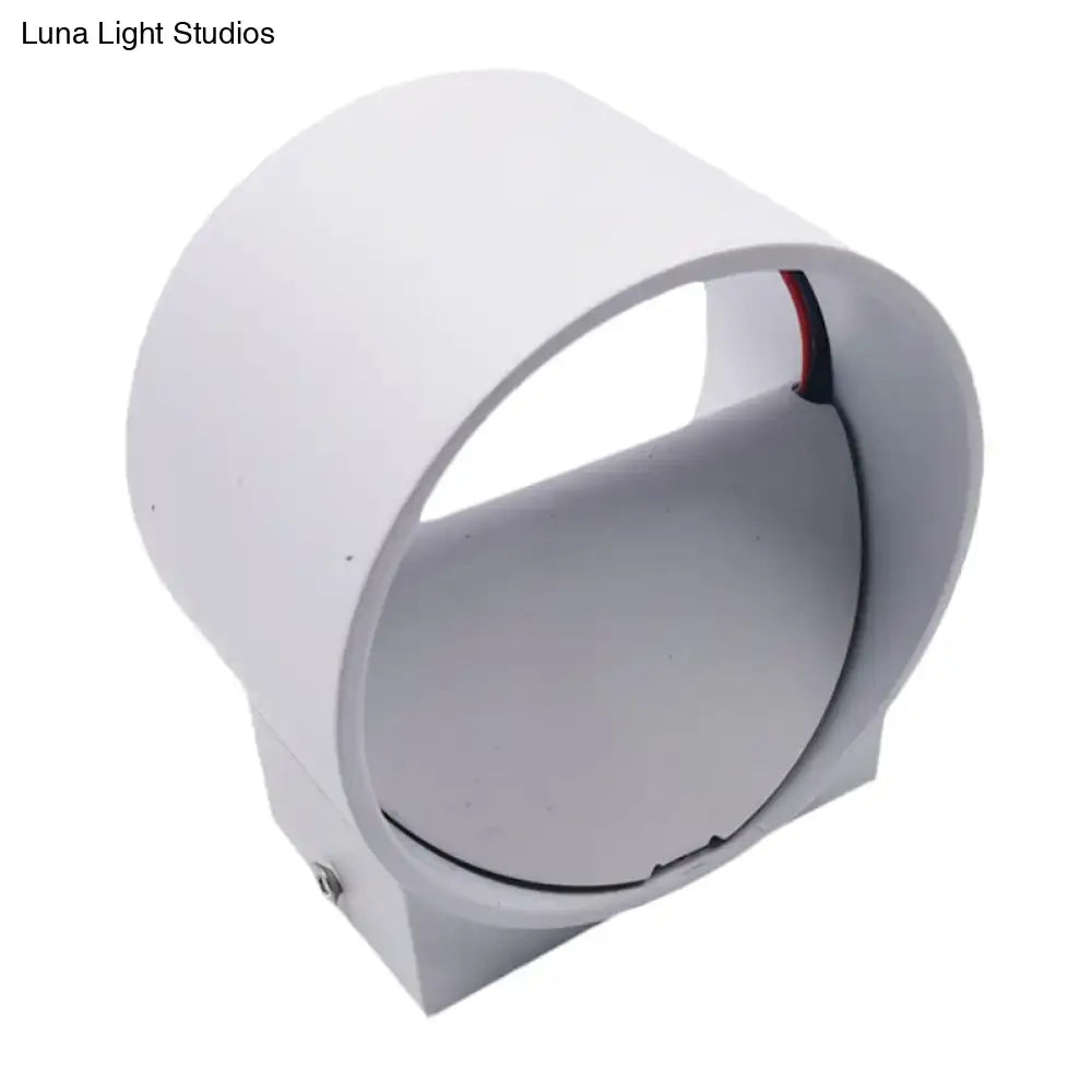 White cylindrical modern wall light with visible wiring included in black and blue velvet wall light kit for bedroom