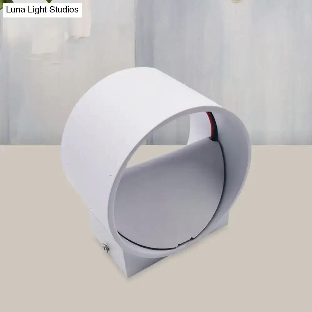 White cylindrical outdoor wall lamp with sleek modern design included in modern black and blue velvet wall light kit