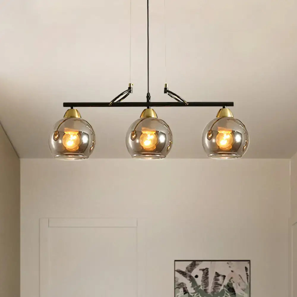 DecorBites™ contemporary 3-bulb black metal bar pendant light with smoke gray glass shades and brass accents for hall island