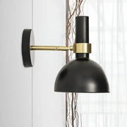 Modern black and brass domed wall lamp with matte finish and brass accent band for bedroom bedside use with led incandescent fluorescent bulbs