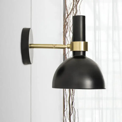 Modern black and brass domed wall lamp with matte finish and brass accent band for bedroom bedside use with led incandescent fluorescent bulbs