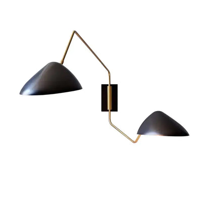 Modern black matte duckbill reading wall light with brass-colored articulated metal arms for bedroom use