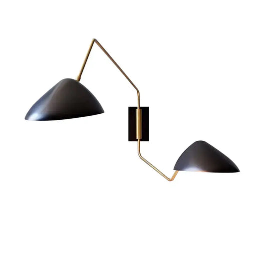 Modern black matte duckbill reading wall light with brass-colored articulated metal arms for bedroom use