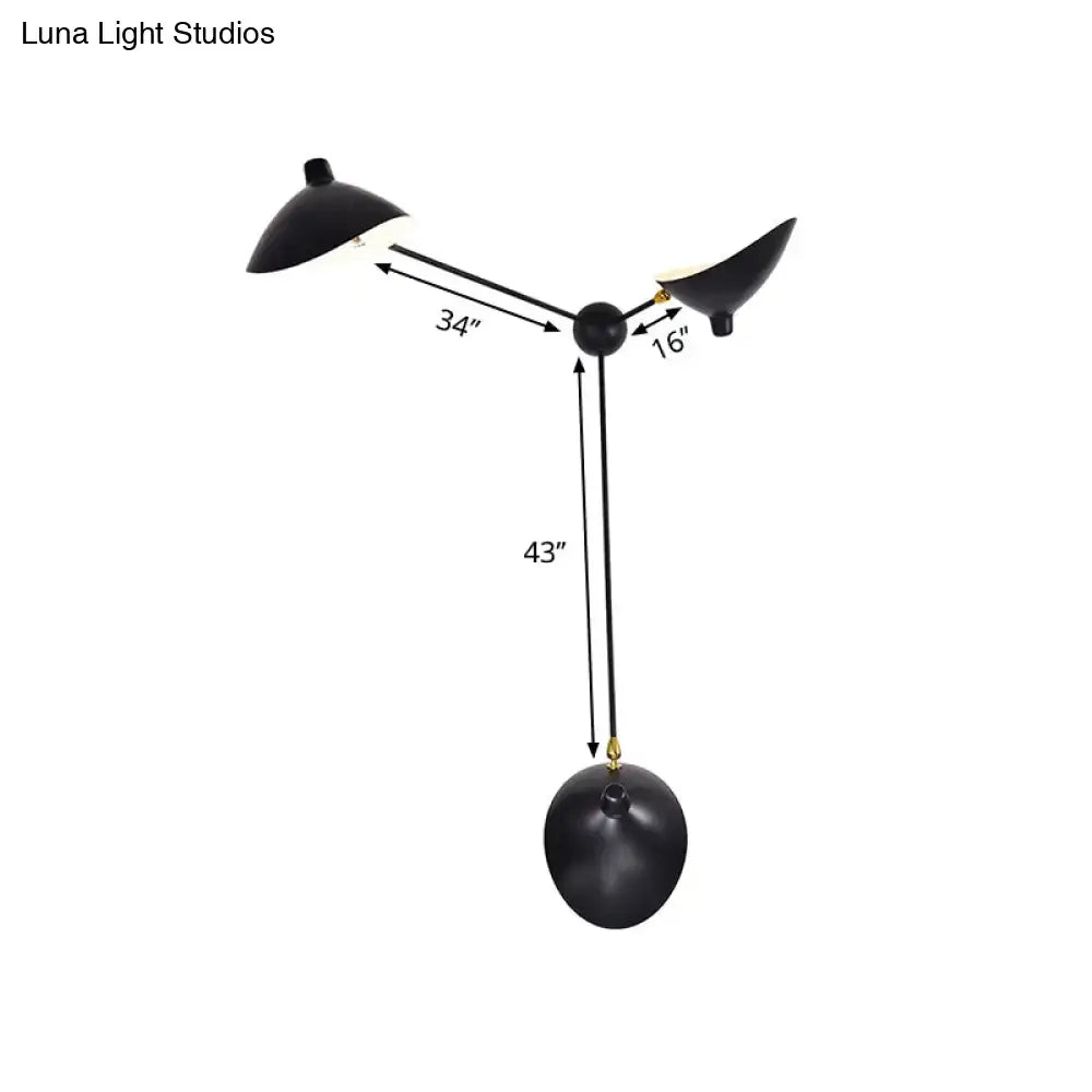 Modern black and brass duckbill wall lamp with three arms metallic shade and compact fixture height for living room use