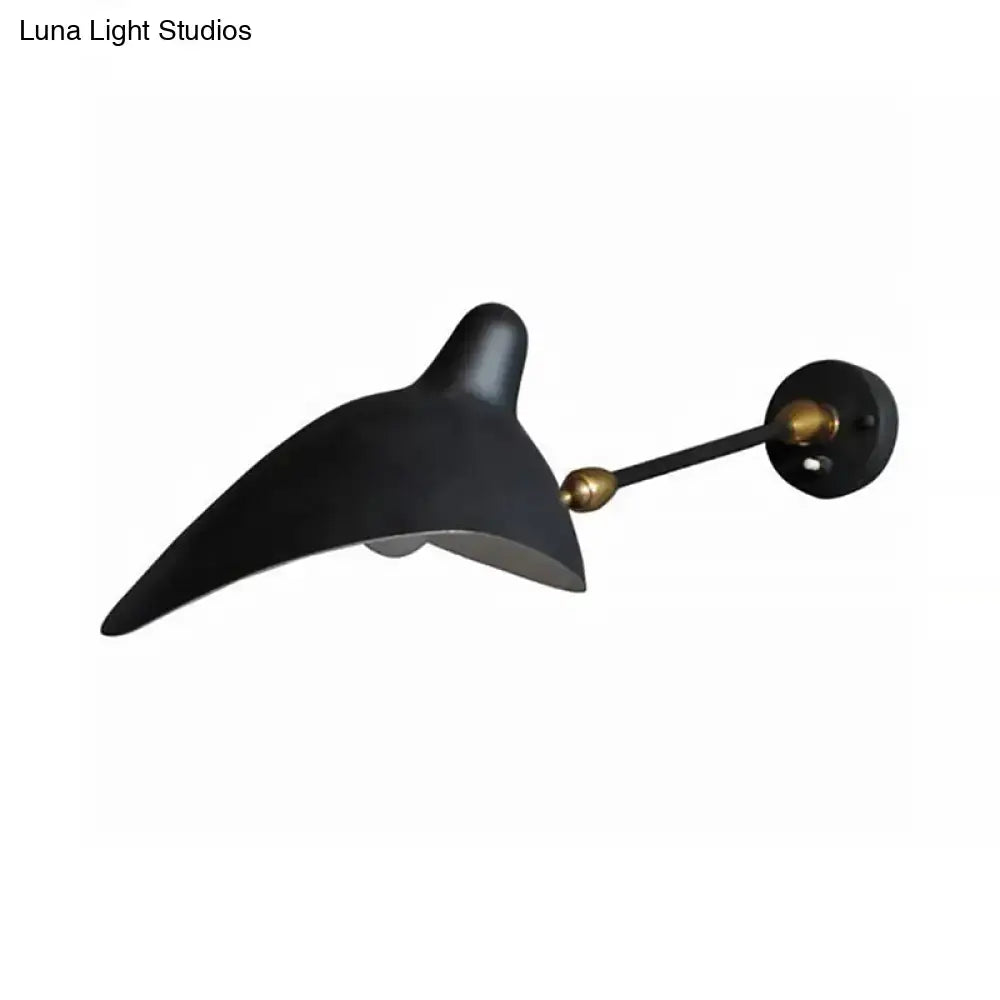 Modern black wall lamp with metallic shade featuring a duckbill design and brass accents, ideal for fixture height in living rooms