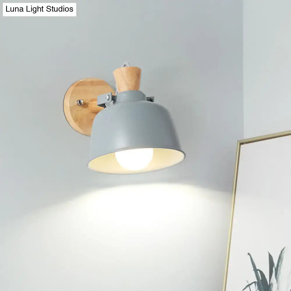Modern black and brass metal wall light with gray metal sconce wood top and cork accent for bedroom use
