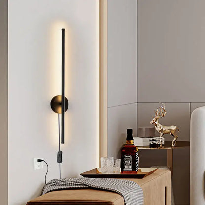 Modern black and brass rotation led wall light with circular brass base and vertical light strip for living room sconce