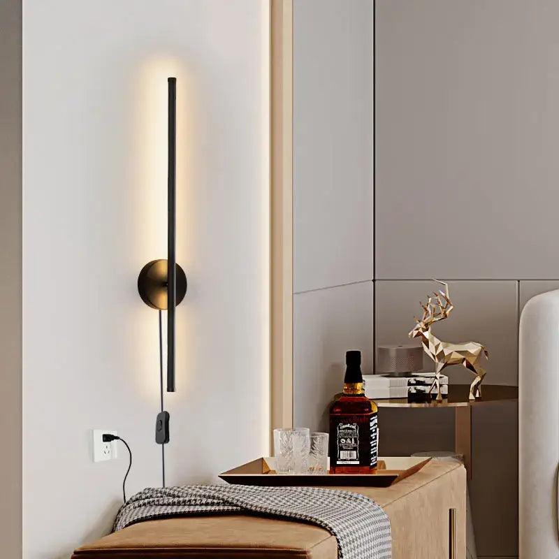Modern black and brass rotation led wall light with circular brass base and vertical light strip for living room sconce