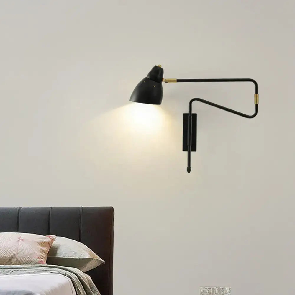 Modern black and brass wall light with articulated arms and backplate width designed for bedroom or studio use with e26 bulb base