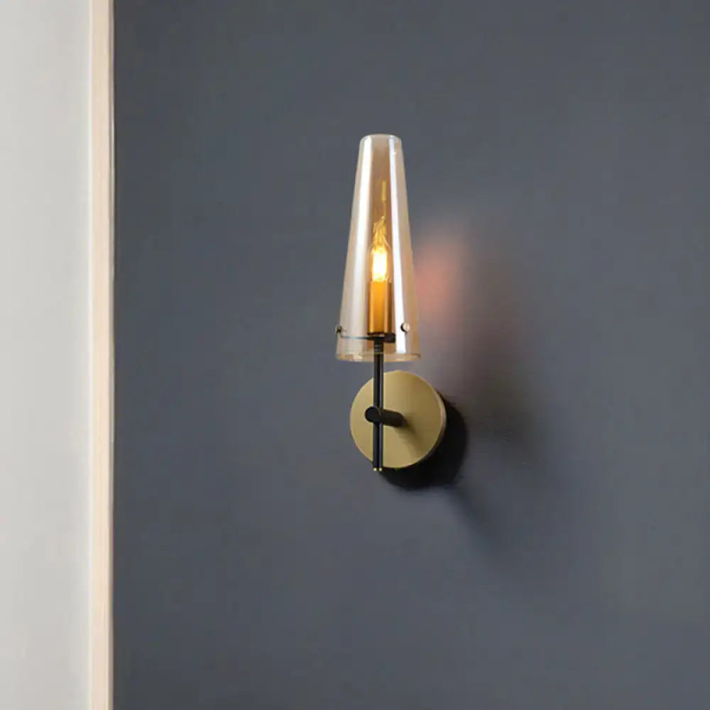 Modern black and brass wall mount light with translucent amber glass shade ideal wall light for study room