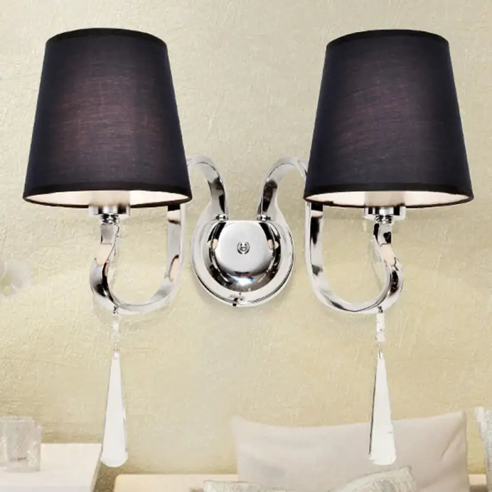 Modern black and chrome crystal wall mount light with double arms, fabric shades, and dangling teardrop accents