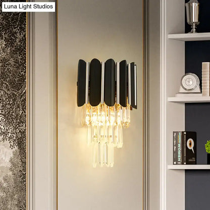 Modern black and chrome wall sconce with cascading clear crystal droplets for bedroom tiered lighting