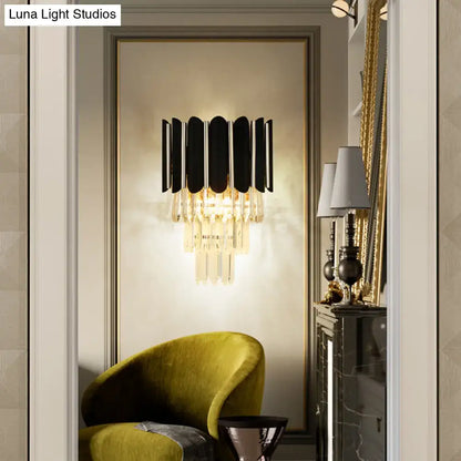 Modern black wall sconce with clear crystal cascading accents for bedroom tiered lighting and elegant decor