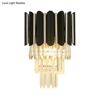 Modern black and silver wall sconce with clear crystal cascading droplets for bedroom tiered lighting