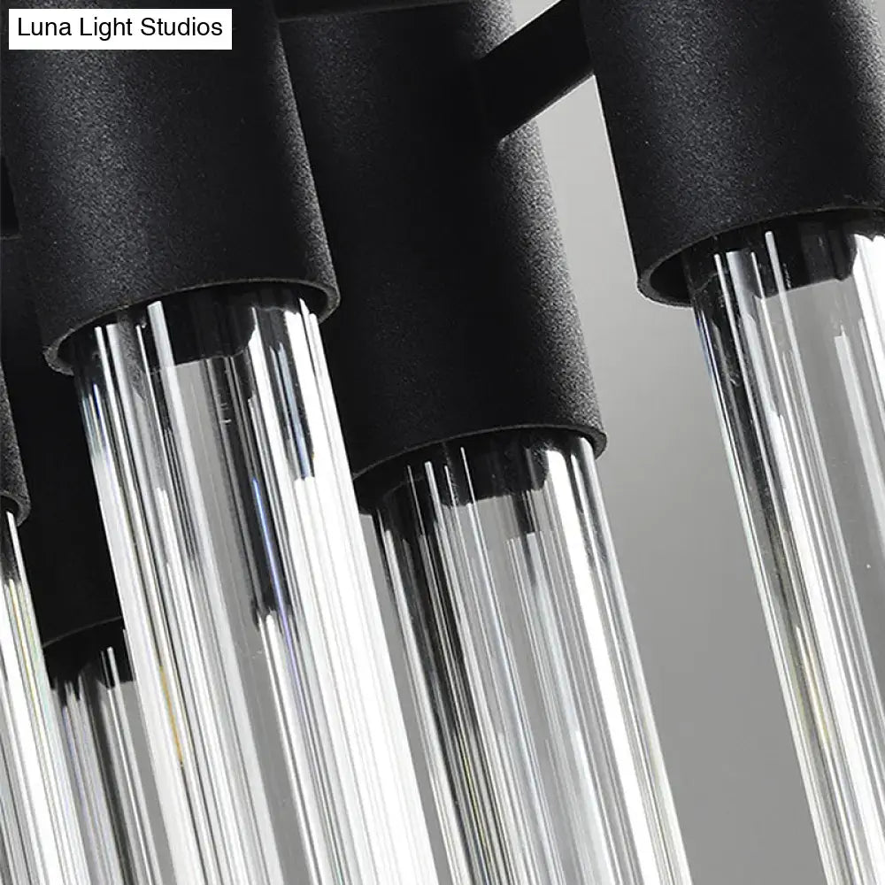Modern black and clear glass tube wall lamp with cylindrical fixtures designed for living room lighting