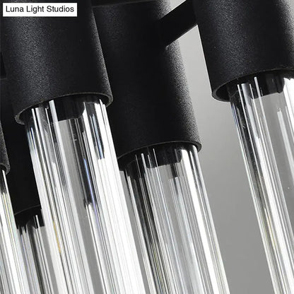Modern black and clear glass tube wall lamp with cylindrical fixtures designed for living room lighting