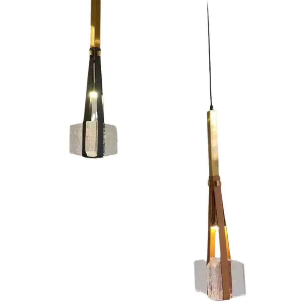 Modern black and clear white resin pendant light with gold-toned metal frames and clear white textured glass bases for kitchen