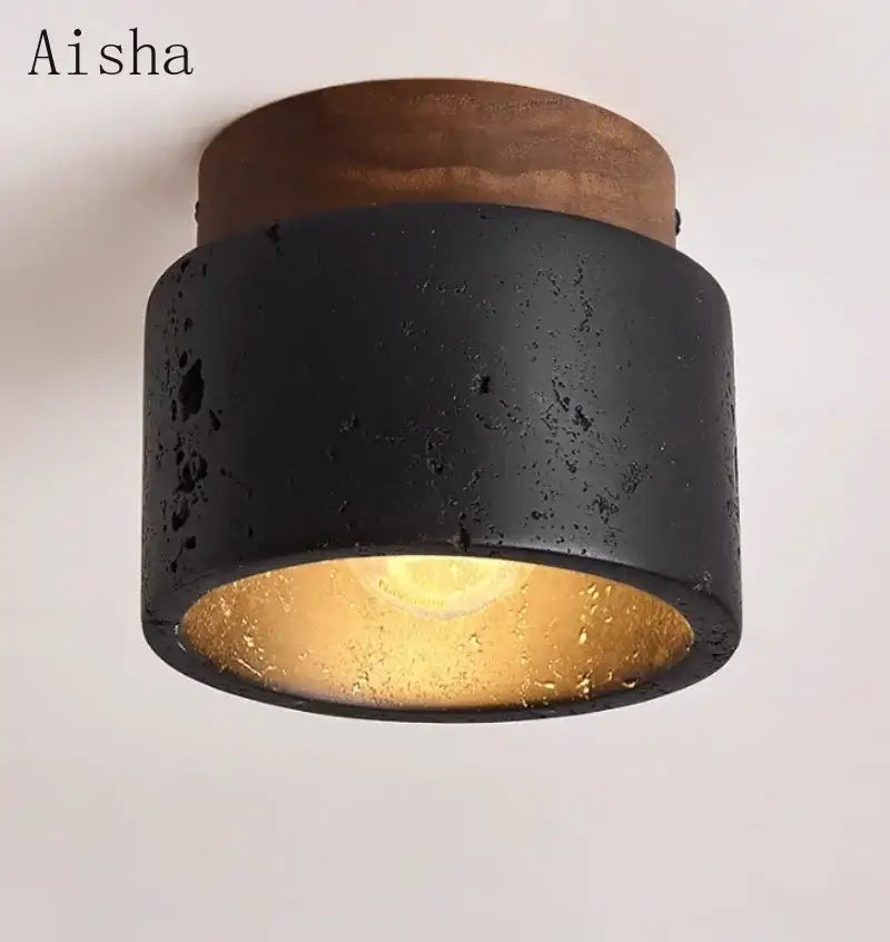 Modern black and gold cave stone ceiling chandelier with textured concrete and wooden top by decorbites cave stone