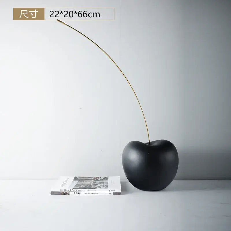 Modern black and gold cherry resin sculpture with glossy black ceramic fruit and slender gold stem for living room decorbites black cherry