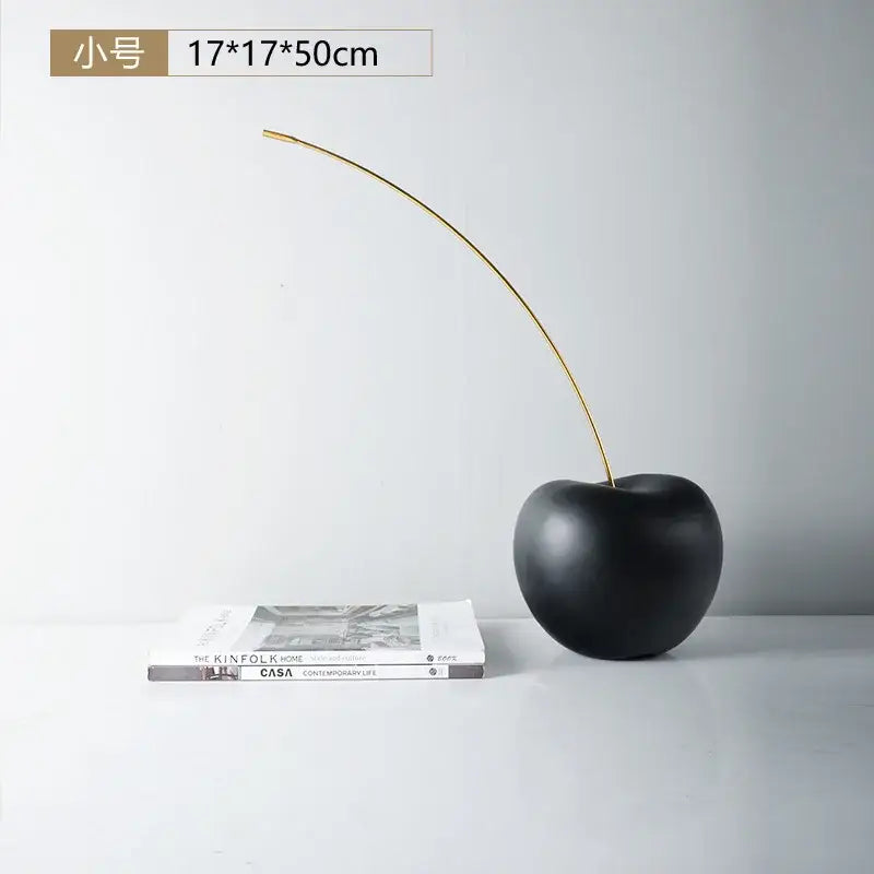 Modern black and gold cherry resin sculpture with matte black cherry resin finish and slender gold stem for decorbites black cherry decor