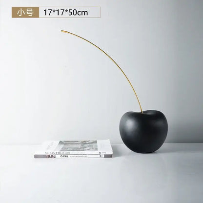 Modern black and gold cherry resin sculpture with matte black cherry resin finish and slender gold stem for decorbites black cherry decor
