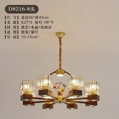 Modern black and gold crystal dining room chandelier with vine design featuring eight crystal-encased lights and wooden bases