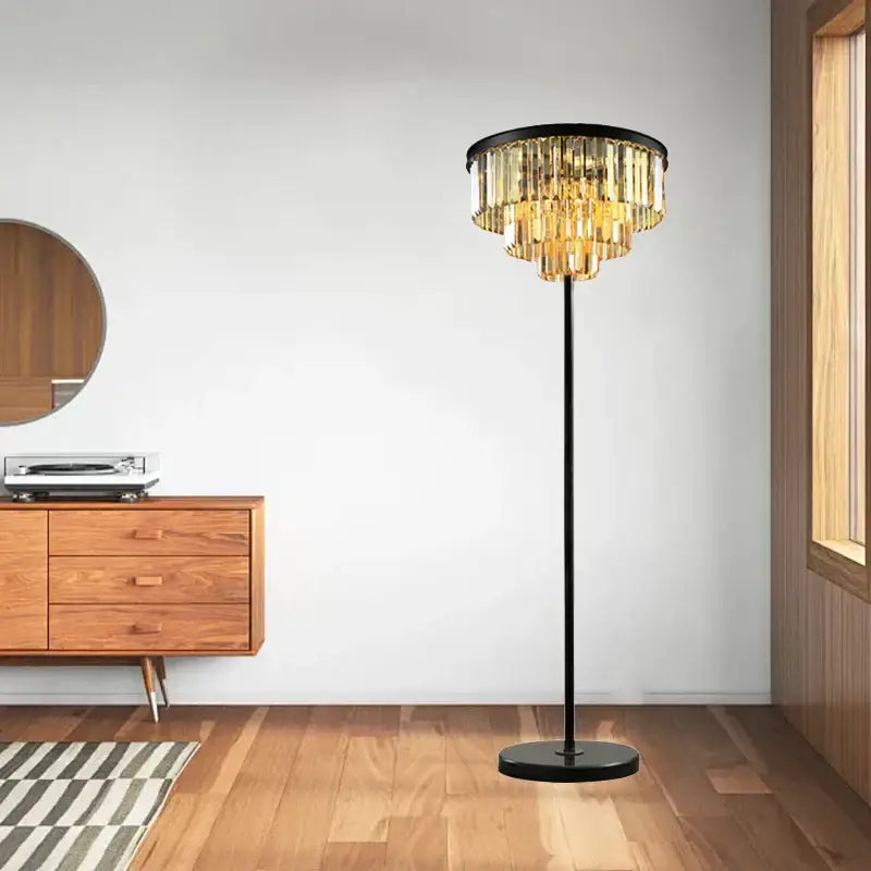 Elegant black and gold crystal floor lamp with cascading golden glass tiers for modern living room decor