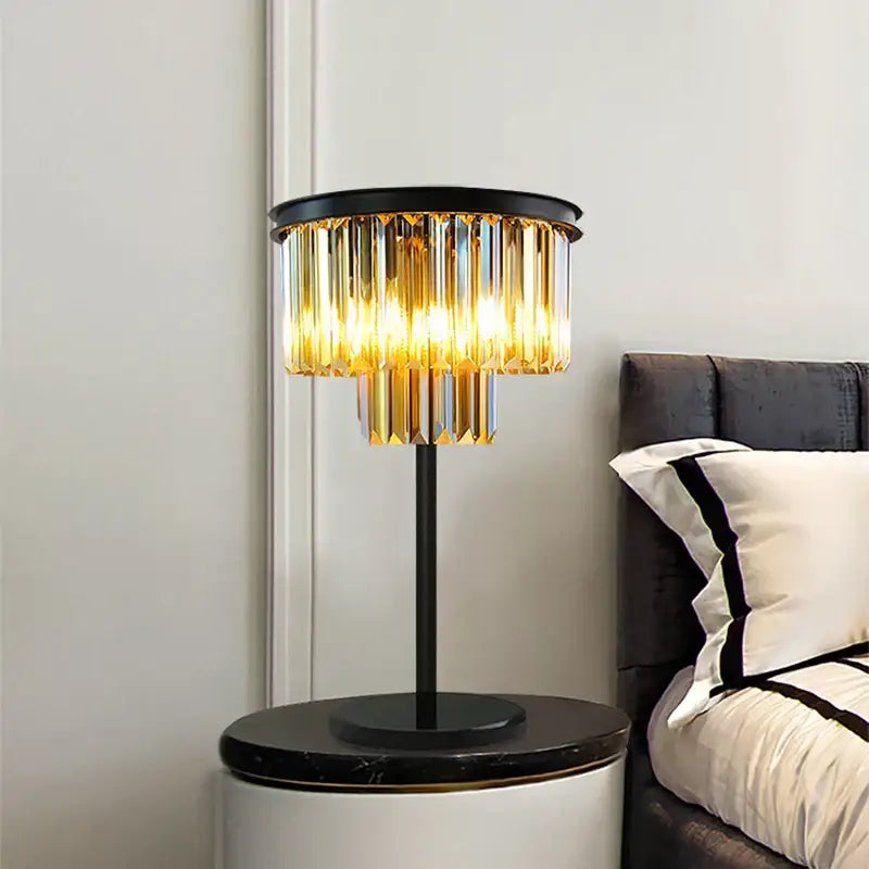 Modern black and gold crystal floor lamp with a metal base and cascading glass prisms for living room decor