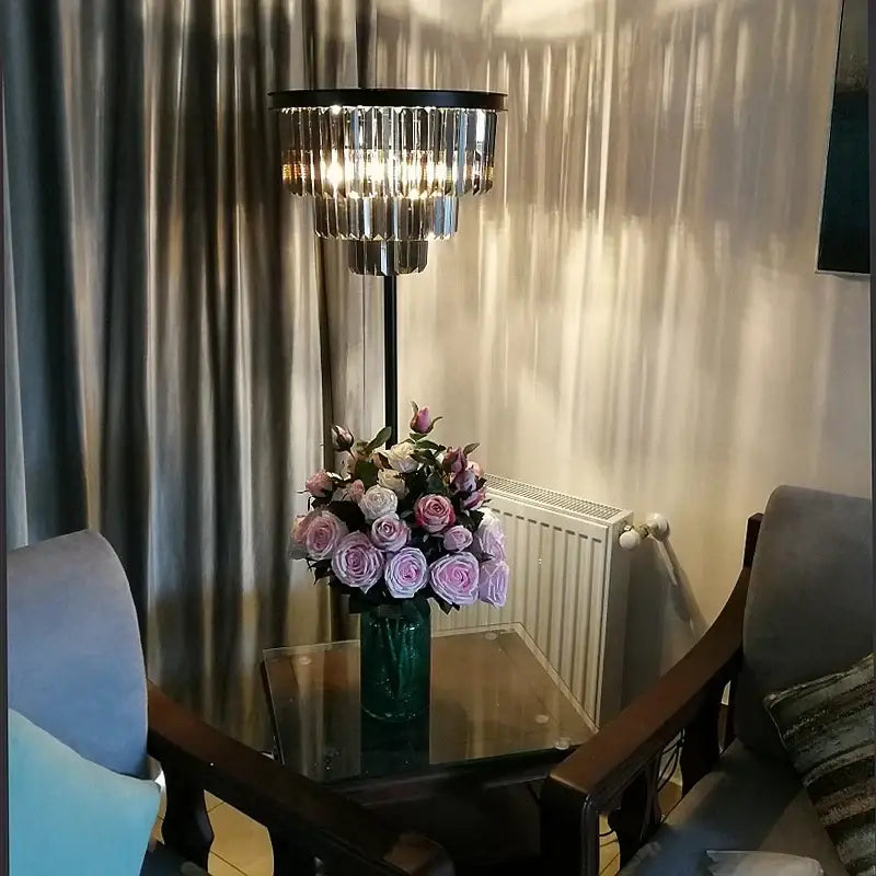 Modern black and gold crystal floor lamp with clear crystal prisms and metal frame for living room decor