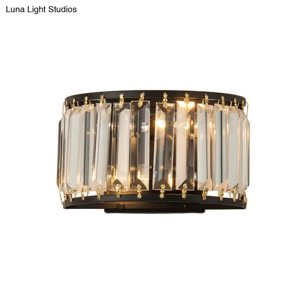 Elegant modern black and gold crystal wall lamp with vertical prisms and gold accents for bedroom lighting