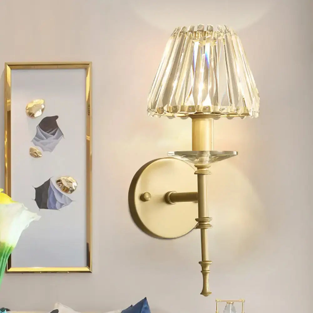 Elegant gold-toned wall light with faceted crystal shade and e12 bulb base fixture height ideal for living room use