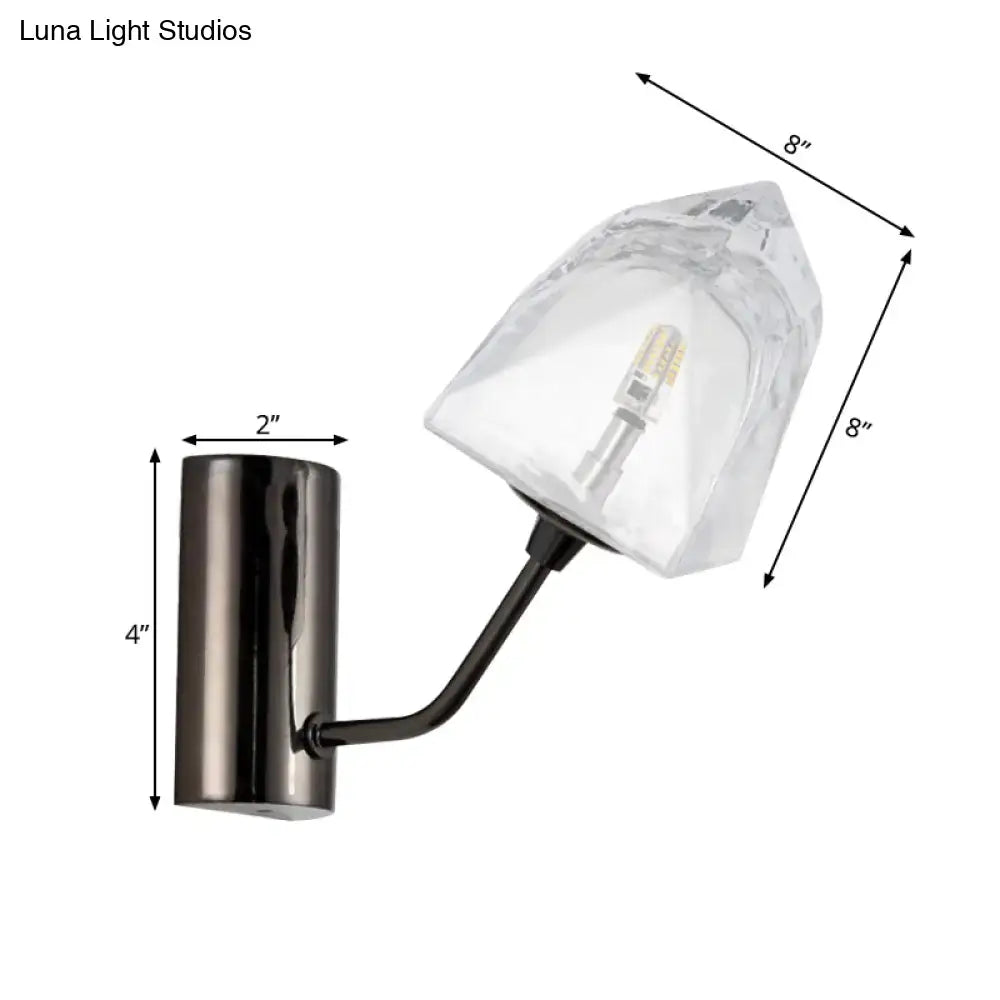 Modern black and gold wall sconce with faceted glass shade featuring bulb base and backplate width details