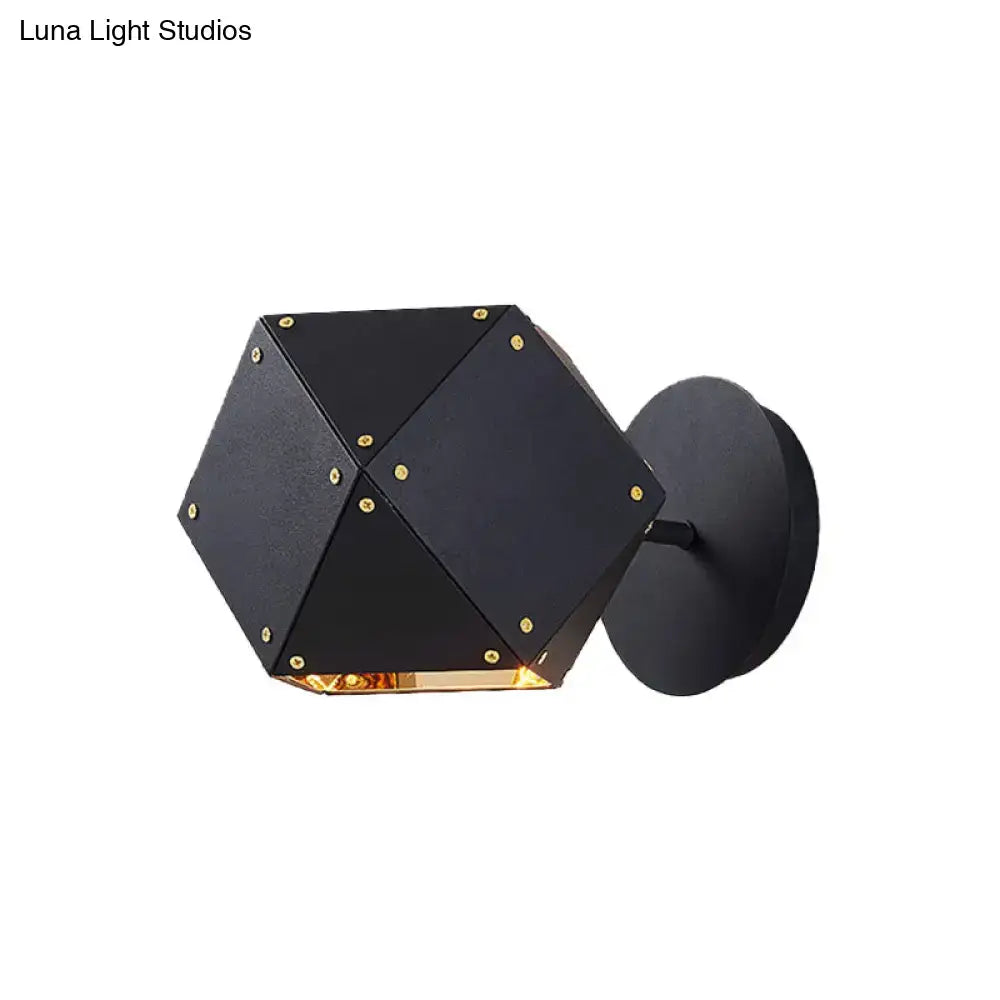 Modern black and gold geometric wall light with hexagonal shape and warm glow for dining room ambiance