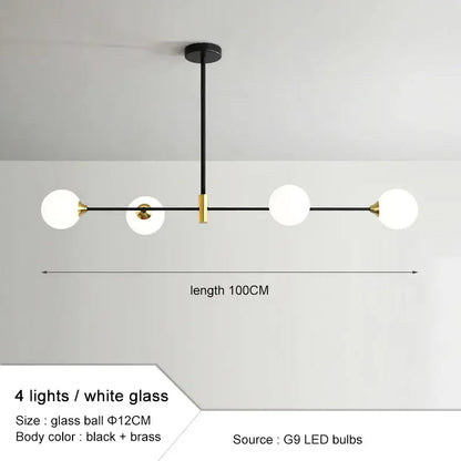 Modern black and gold glass ball pendant chandelier with four white glass spheres and brass frame for dining room decorbites glass ball