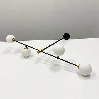 Modern black and brass decorbites glass ball pendant chandelier with four frosted white shades for dining room decor